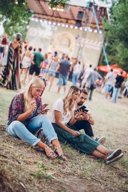 istock Using phones on a music festival 1151254546