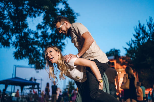 istock Piggyback ride on a music festival 1151255355