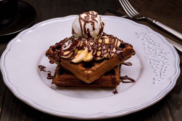istock Chocolate waffle with banana and ice cream 1151258503