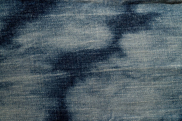istock Close up of  blue denim jeans fabric texture background. 1151259329