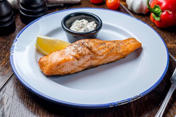 istock Salmon steak on the grill 1151268073
