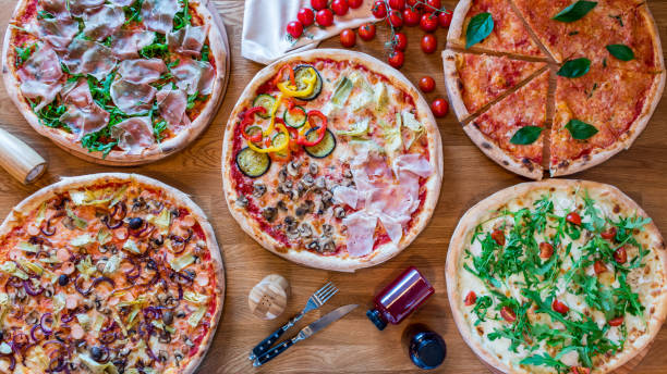 istock Italian pizzas and salads top view 1151268436