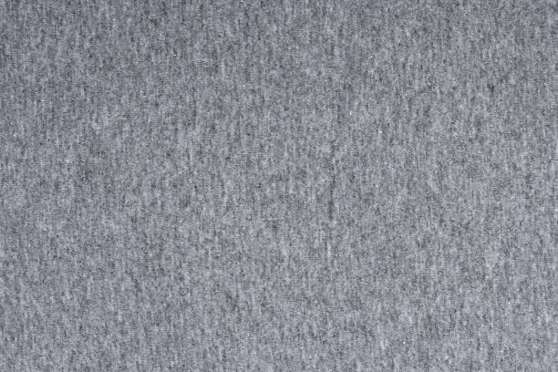 Grey jersey fabric texture background. Grey jersey fabric texture background. High resolution photo. Full depth of field. heather grey stock pictures, royalty-free photos & images