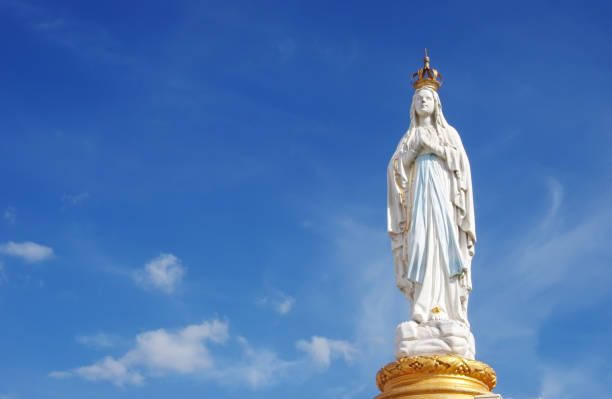 Our Lady, Virgin Mary, Mother of God Our Lady, Virgin Mary, Mother of God in cloud sky fatima statue stock pictures, royalty-free photos & images