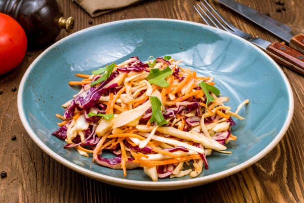 istock coleslaw salad with cabbage and carrots 1151271188