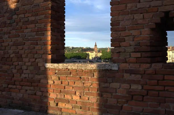 Walking on the Scaliger bridge in Verona and looking out among the battlements