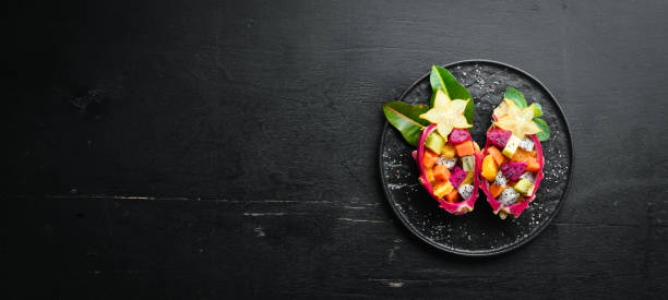 istock Dragon fruit. Tropical Fruit Salad. Top view. Free space for text. 1151274070