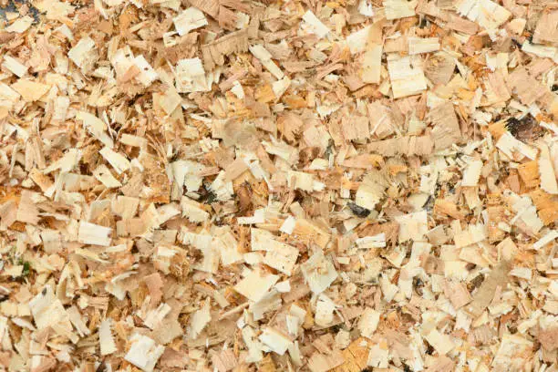 A Freshly Laid Layer of Large Garden Bark Woodchips. Woodchips used as safe soft surface in a childrens play park, Top Down View. High resolution photo. Full depth of field.