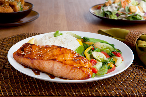 miso salmon dinner with rice and vegetables, side salad