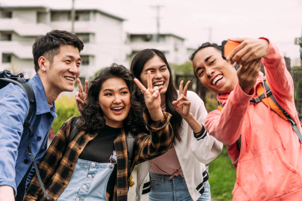istock Four multi ethnic friends posing for selfie on smartphone 1151279035