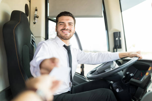 istock Happy Man Selling Tickets In Bus 1151279853