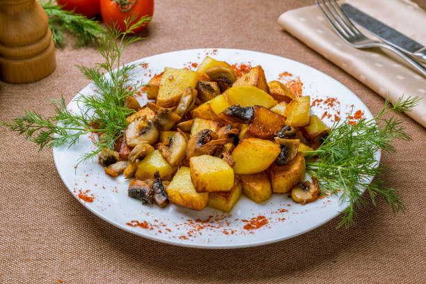 istock Fried potatoes with mushrooms 1151279996