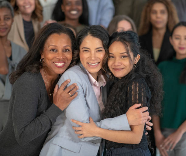istock A mixed age group of women hugging 1151281022
