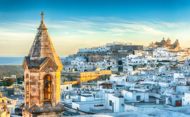 istock white town Ostuni and cathedral at sunrise 1151282141
