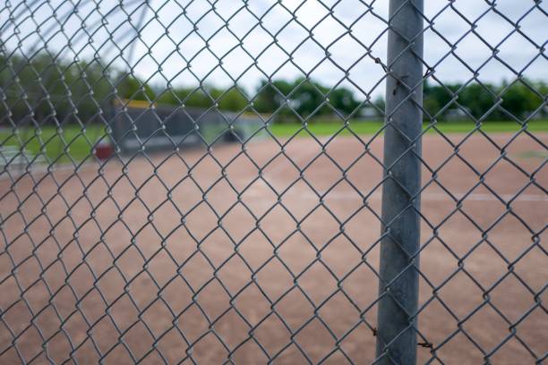istock Baseball Diamond Through Fence 1151282360