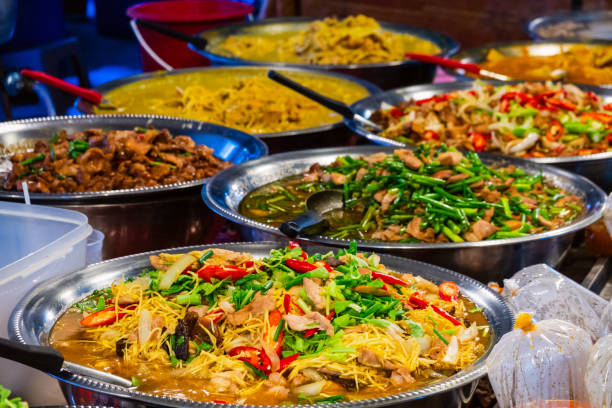 Thai street food vendor in Bangkok, Thailand Thai food on the street is popular and sell well, not less than Pad Thai and Tom Yum Shrimp are various curries. street food stock pictures, royalty-free photos & images