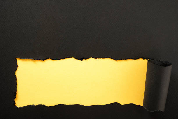 istock Paper strip torn black yellow background horizontal bottom edge 1151284139
