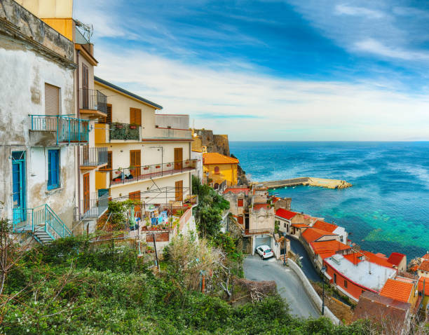 town village Scilla Beautiful seaside town village Scilla with old medieval castle on rock Castello Ruffo, colorful traditional typical italian houses on Mediterranean Tyrrhenian sea coast shore, Calabria, Southern Italy castle scilla stock pictures, royalty-free photos & images