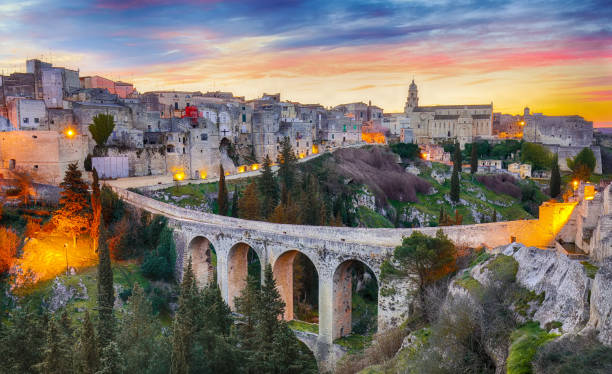Gravina in Puglia Gravina in Puglia ancient town, bridge and canyon at sunrise. Panoramic view of old city Gravina in Puglia, Apulia, Italy. Europe murge photos stock pictures, royalty-free photos & images