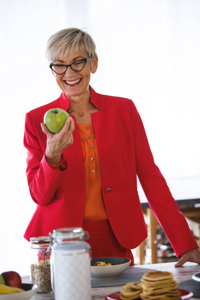 istock Woman holding apple 1151286003