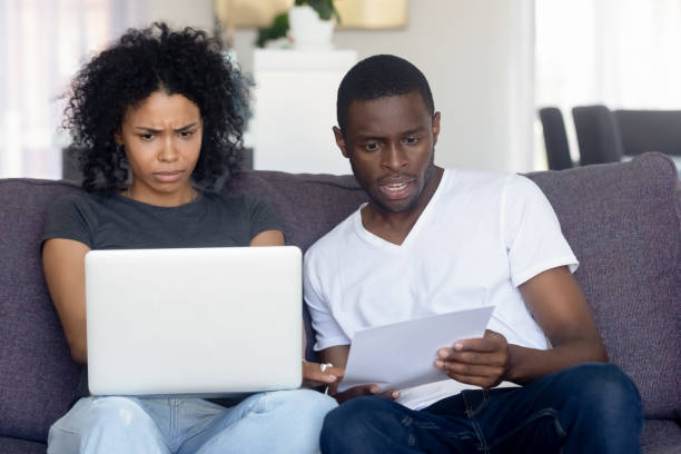 istock Confused black couple have problems with online paying 1151287265