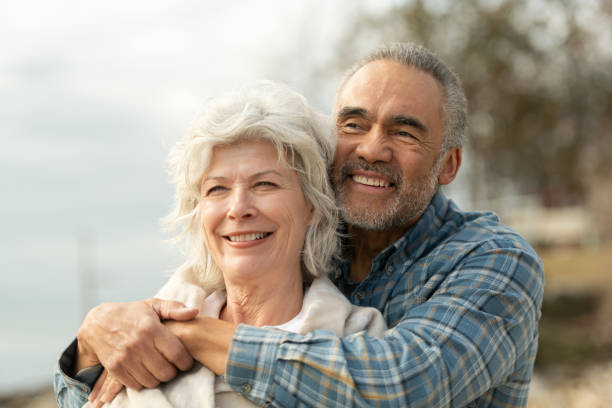istock Laughing senior couple on a beach 1151287574