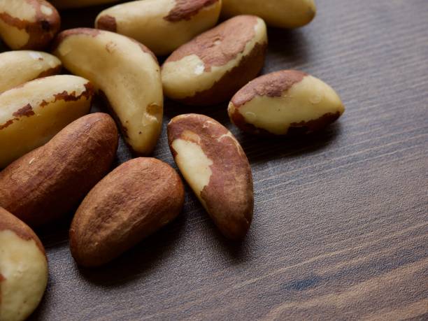 istock Brazil nuts on wooden boards, nuts 1151290548
