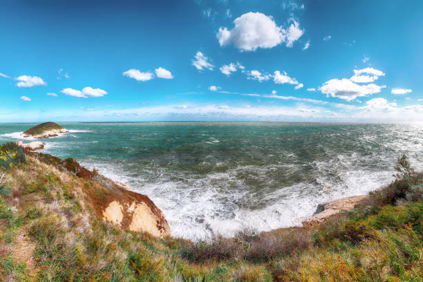 Above the cliffs at the coastline of Vieste. Summer rocky sea coast Baia Di Campi Vieste on the Gargano peninsula, Puglia, Italy