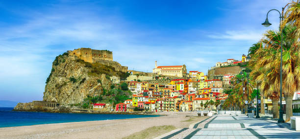 village Scilla with old medieval castle on rock Castello Ruffo Beautiful seaside town village Scilla with old medieval castle on rock Castello Ruffo, colorful traditional typical italian houses on Mediterranean Tyrrhenian sea coast shore, Calabria, Southern Italy castle scilla stock pictures, royalty-free photos & images
