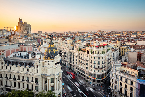 Madrid, España, Sunset over Madrid Cityscape mostrando edificios emblemáticos en la calle gran vía photo