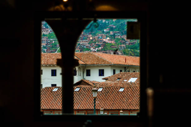 istock Typical colonial buildings of Cusco (Peru) seen through an arcade 1151294715