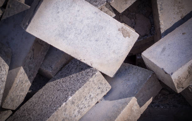 istock Pile of curb bricks. background, vignetted texture 1151296781