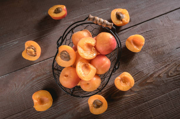 istock Delicious ripe apricots in a bowl 1151314076