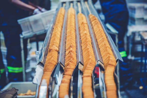 Factory, Food Industry, Production Line - Freshly Baked Biscuits Traveling Down the Production Line for Final Inspection and Packaging