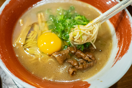 Soup of Tokushima ramen is either brown, yellow or white. The noodles in the broth are moderately thin and soft. The toppings are Chashu, green onions, bean sprouts and a raw egg.