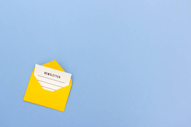 Yellow envelope with newsletter on blue background