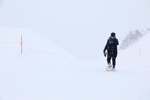 Alone man walking on the snow falling day , Gala Yuzawa.Japan