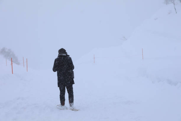 Alone man walking on the snow falling day , Gala Yuzawa.Japan