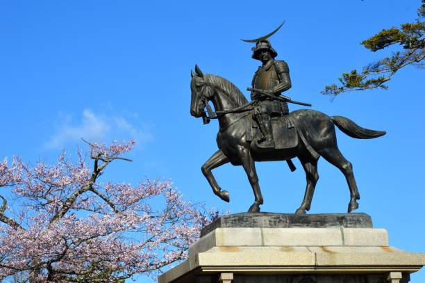 Cherry Blossoms and the Statue of Date Masamune Cherry Blossoms and the Statue of Date Masamune bronze statue stock pictures, royalty-free photos & images