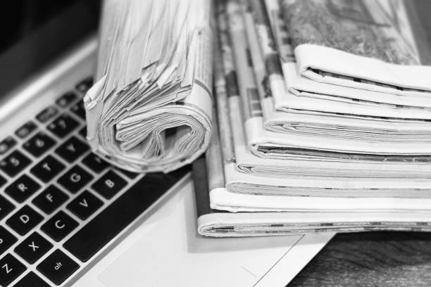 istock Newspapers and Laptop 1151320871