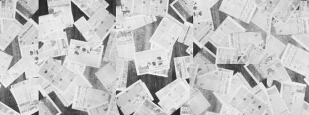 istock Long Horizontal Banner with Blurred Newspapers 1151320950