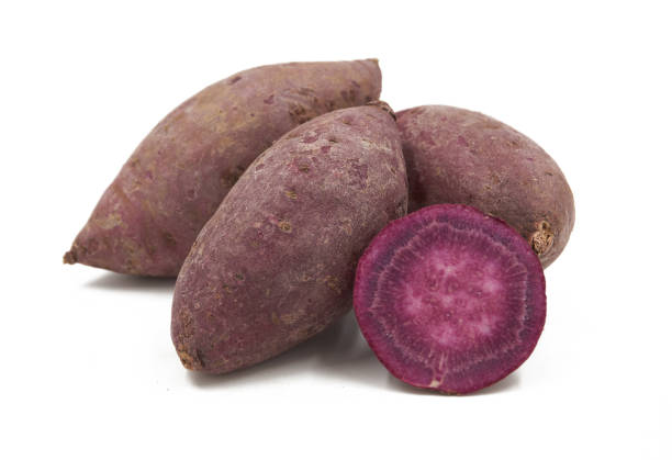istock Purple Colored Sweet Potatoes on White background 1151320951