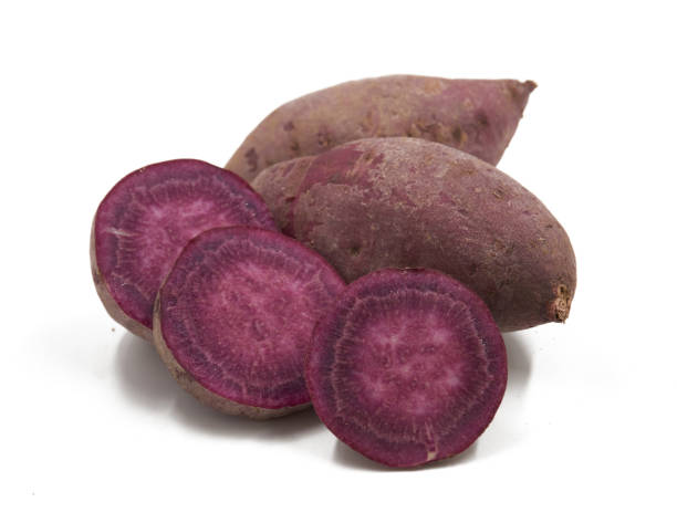 istock Purple Colored Sweet Potatoes on White background 1151320971
