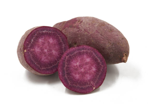 istock Purple Colored Sweet Potatoes on White background 1151320972