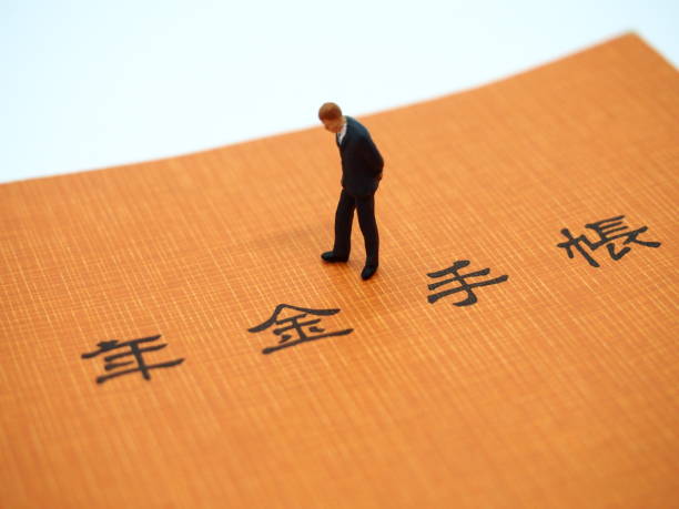 istock Pension Handbook and Miniature Man 2 1151320991