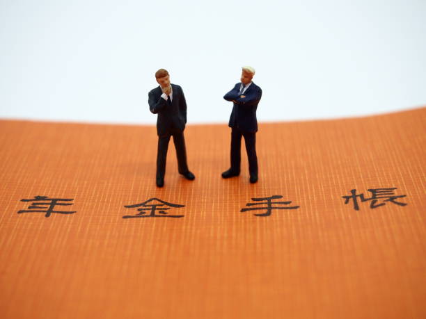 Pension handbook and two businessmen