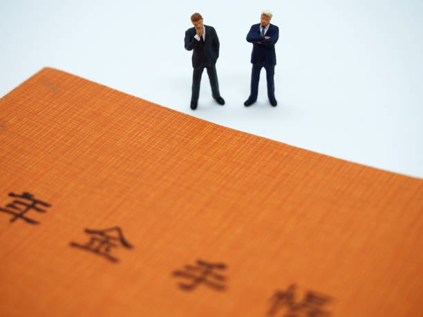 istock Pension handbook and two businessmen 3 1151321002