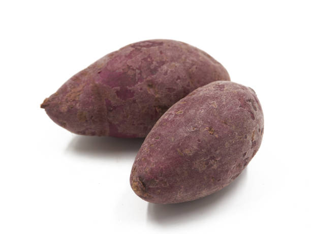 istock Purple Colored Sweet Potatoes on White background 1151321027