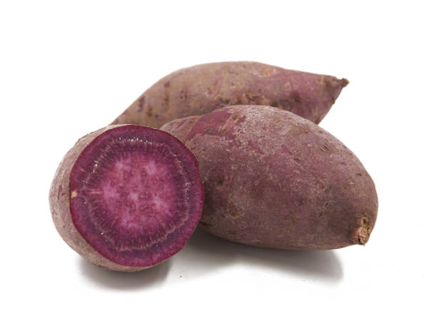 istock Purple Colored Sweet Potatoes on White background 1151321028