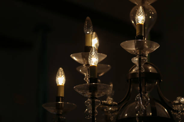 istock Beautiful electric chandelier on a dark background 1151324934